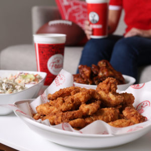 Slim Chickens Feed your gameday crowd with tenders, coleslaw, and wings